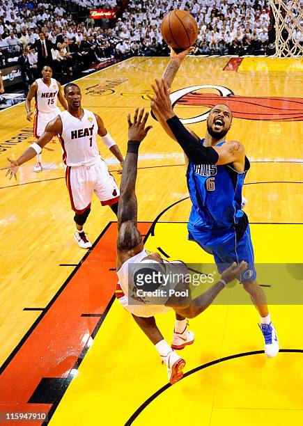 Tyson Chandler of the Dallas Mavericks attempts a shot against LeBron James of the Miami Heat in Game Six of the 2011 NBA Finals at American Airlines...