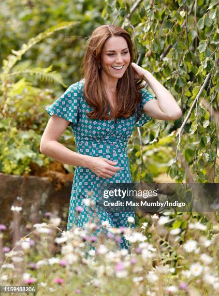 Catherine, Duchess of Cambridge visits the RHS Hampton Court Palace Garden Festival to view the RHS 'Back to Nature Garden' which she co-designed at...