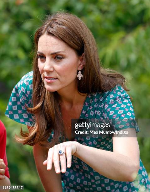 Catherine, Duchess of Cambridge visits the RHS Hampton Court Palace Garden Festival to view the RHS 'Back to Nature Garden' which she co-designed at...