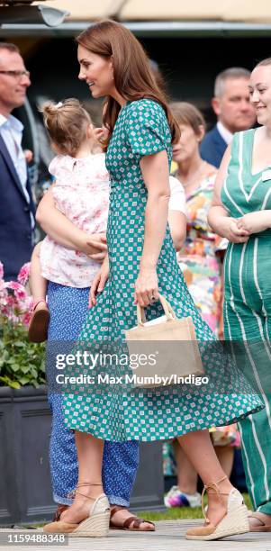 Catherine, Duchess of Cambridge visits the RHS Hampton Court Palace Garden Festival to view the RHS 'Back to Nature Garden' which she co-designed at...