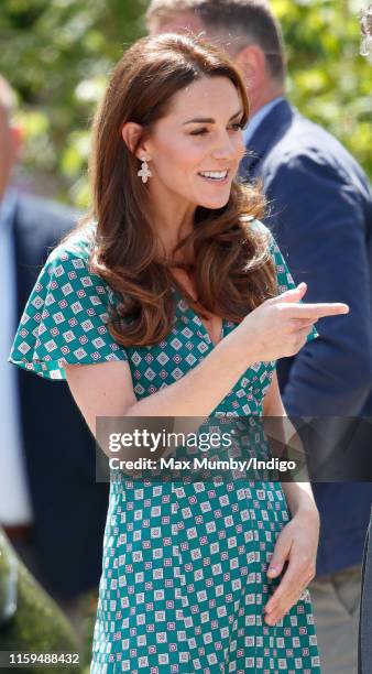 Catherine, Duchess of Cambridge visits the RHS Hampton Court Palace Garden Festival to view the RHS 'Back to Nature Garden' which she co-designed at...