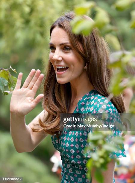 Catherine, Duchess of Cambridge visits the RHS Hampton Court Palace Garden Festival to view the RHS 'Back to Nature Garden' which she co-designed at...