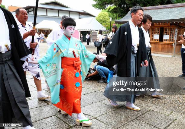 Yutaro Kobayashi, acts as 'Chigo' attends the 'Osendo-no-Gi' ritual to pray for the success as the start of the Kyoto Gion Festival at the Yasaka...