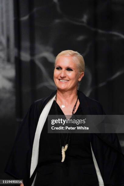 Designer Maria Grazia Chiuri acknowledges the applause of the public after the Christian Dior Haute Couture Fall/Winter 2019 2020 show as part of...