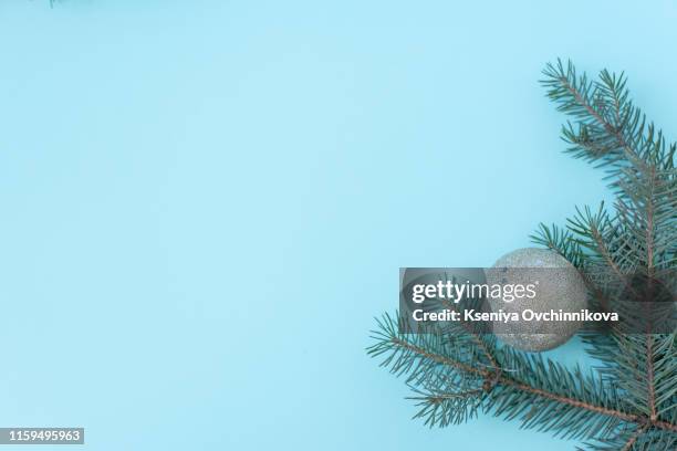 christmas or winter composition. frame made of snowflakes and red berries on pastel blue background. christmas, winter, new year concept. flat lay, top view, copy space - snow border stock pictures, royalty-free photos & images