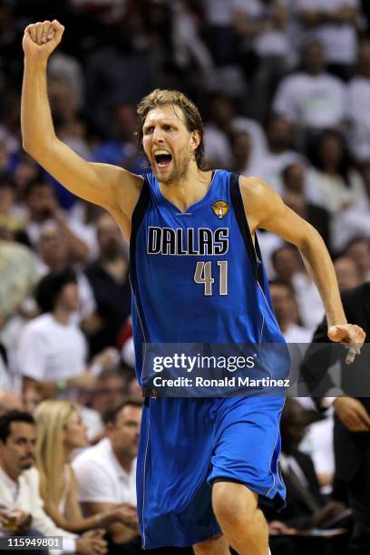 Dirk Nowitzki of the Dallas Mavericks reacts after making a three-pointer in the fourth quarter while taking on the Miami Heat in Game Six of the...