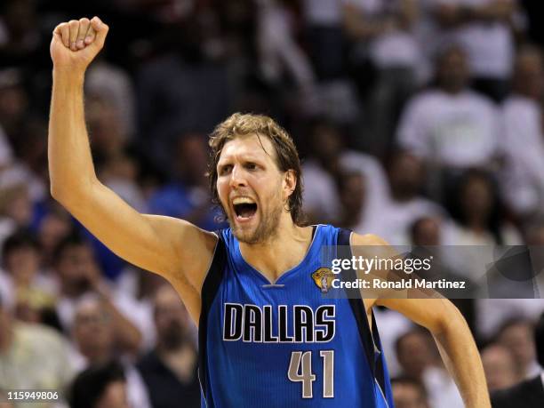Dirk Nowitzki of the Dallas Mavericks reacts after making a three-pointer in the fourth quarter while taking on the Miami Heat in Game Six of the...
