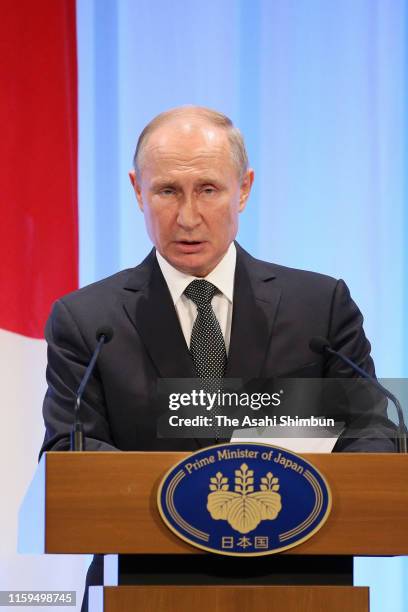 Russian President Vladimir Putin speaks during a joint press conference with Japanese Prime Minister Shinzo Abe following their bilateral meeting on...