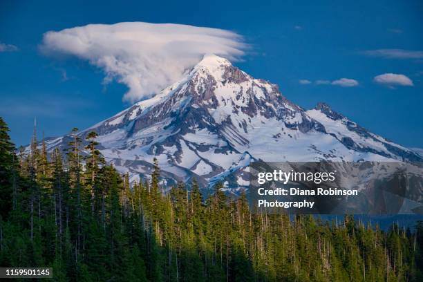 interesting cloud formation above mt. hood as seen from lost lake, mt. hood national forest, cascade mountains, oregon - mt hood stock pictures, royalty-free photos & images