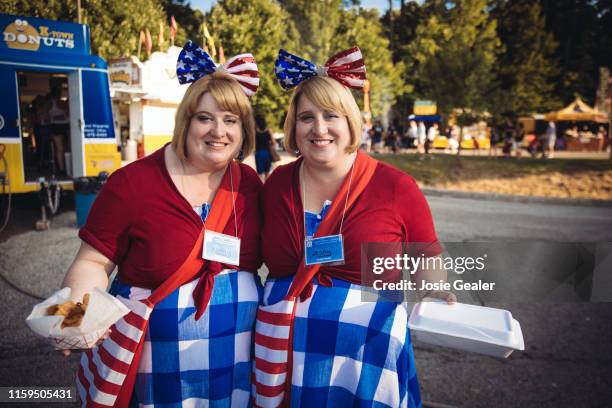 Identical twin sisters attend the Twins Days Festival at Glenn Chamberlin Park on August 3, 2019 in Twinsburg, Ohio. Twins Day celebrates biological...