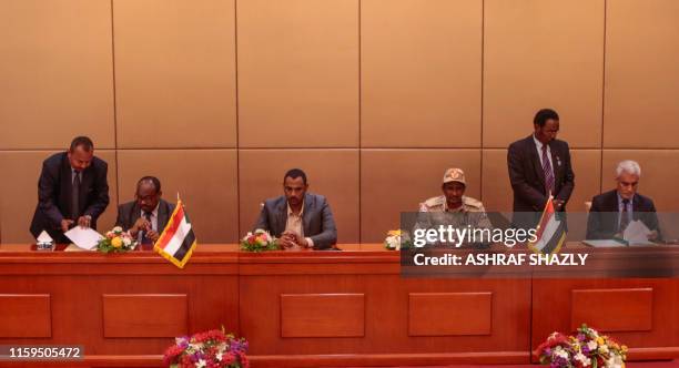 Ethiopian mediator Mahmoud Drir, protest leader Ahmad Rabie, General Mohamed Hamdan Daglo, Sudan's deputy head of the Transitional Military Council,...