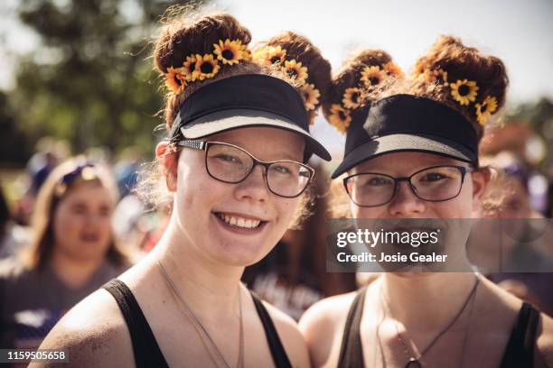 Identical twin sisters attend the Twins Days Festival at Glenn Chamberlin Park on August 3, 2019 in Twinsburg, Ohio. Twins Day celebrates biological...