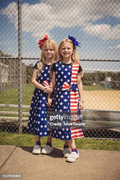 Identical twin sisters attend the Twins Days Festival at Glenn Chamberlin Park on August 3, 2019 in Twinsburg, Ohio. Twins Day celebrates biological...