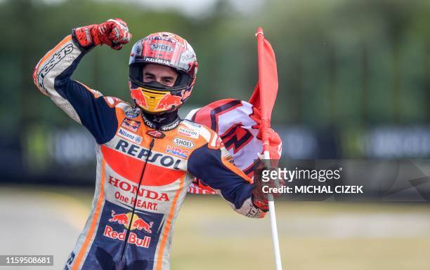 Winner Repsol Honda Team's Spanish rider Marc Marquez celebrates after the Moto GP Czech Grand Prix in Brno on August 4, 2019.