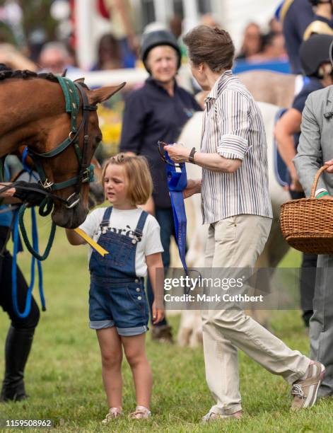 Mia Tindall and Princess Anne, Princess Royal present prizes during the 2019 Festival of British Eventing at Gatcombe Park on August 4, 2019 in...