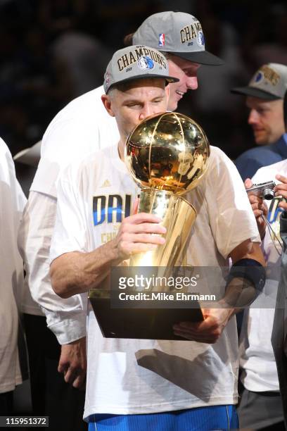 Jason Kidd of the Dallas Mavericks kisses the Larry O'Brien trophy after the Mavericks won 105-95 against the Miami Heat in Game Six of the 2011 NBA...
