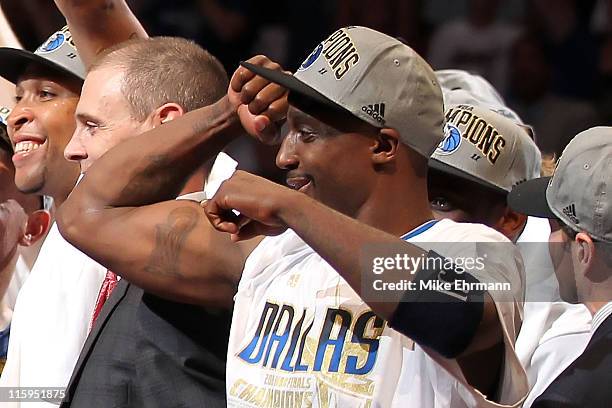 Jason Terry of the Dallas Mavericks points towards his tattoo of the Larry O'Brien trophy as he celebrates their 105-95 win against the Miami Heat in...