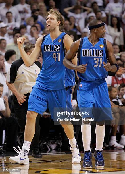 Dirk Nowitzki celebrates with Jason Terry after scoring in the fourth during Game 6 of the NBA Finals at the AmericanAirlines Arena in Miami,...