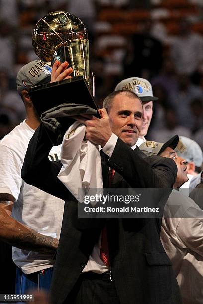 Head coach Rick Carlisle of the Dallas Mavericks celebrates with the Larry O'Brien trophy after the Mavericks won 105-95 against the Miami Heat in...