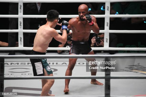 Demetrious Johnson of the USA and Tatsumitsu Wada of Japan during their match for the ONE Championship Dawn of Heroes event held at the Mall of Asia...