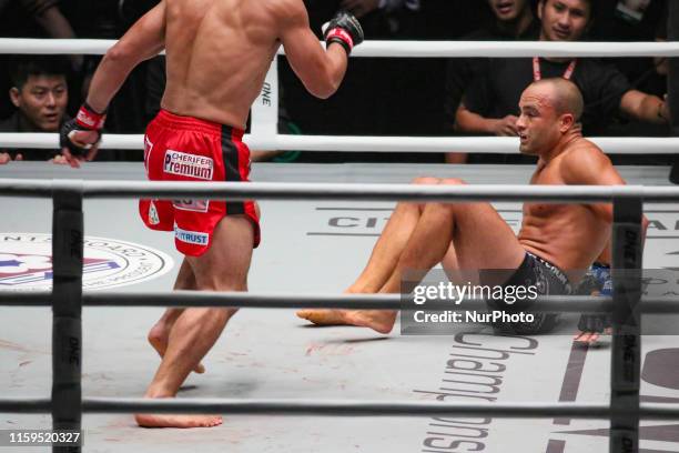 Eddie Alvarez of the USA gets knocked down by Eduard Folayang of the Philippines during their match for the ONE Championship Dawn of Heroes event...