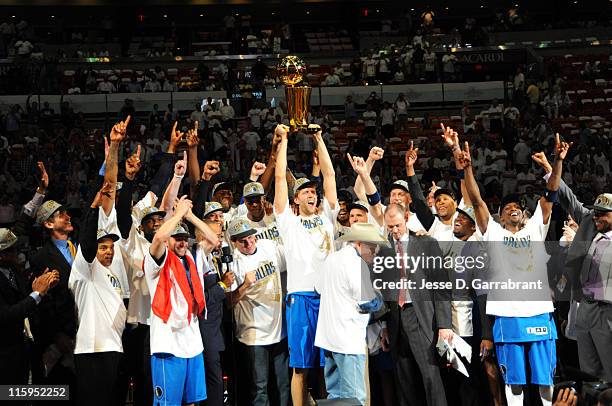 The Dallas Mavericks celebrate after winning the NBA Championship by defeating the Miami Heat during Game Six of the 2011 NBA Finals on June 12, 2011...