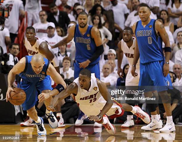 Jason Kidd of the Dallas Mavericks controls a loose ball against Mario Chalmers of the Miami Heat in Game Six of the 2011 NBA Finals at American...