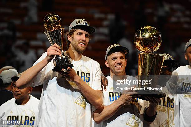 Dirk Nowitzki of the Mavericks holds the championship trophy after  defeating the Heat during Game 6 of the NBA Finals at the AmericanAirlines  Arena in Miami, Florida, Sunday, June 12, 2011. The