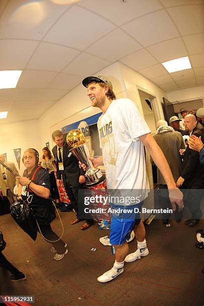 Dirk Nowitzki of the Dallas Mavericks celebrates in the locker room after the Mavericks defeated the Miami Heat 105-95 in Game Six to capture the...