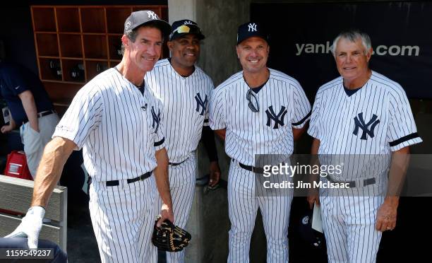 Paul O'Neill, Marcus Thames, Tino Martinez and Lou Piniella pose for a photograph during New York Yankees Old Timers Day prior to a game between the...