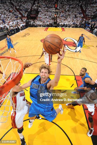 Dirk Nowitzki of the Dallas Mavericks shoots against Udonis Haslem of the Miami Heat during Game Six of the 2011 NBA Finals on June 12, 2011 at the...