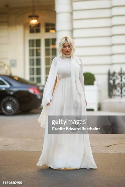 Caroline Vreeland wears a white dress, outside Giambattista Valli, during Paris Fashion Week -Haute Couture Fall/Winter 2019/2020, on July 01, 2019...
