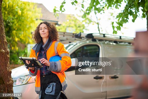 Female heating engineer arrives at job Female heating engineer arrives at job