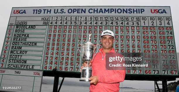 Gary Woodland of the United States poses with the trophy after winning the 2019 U.S. Open at Pebble Beach Golf Links on June 16, 2019 in Pebble...