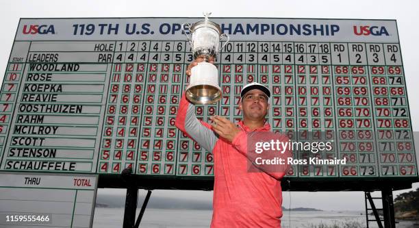 Gary Woodland of the United States poses with the trophy after winning the 2019 U.S. Open at Pebble Beach Golf Links on June 16, 2019 in Pebble...