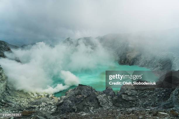 scenic view of ijen volcano and sulphur minings - sulphur stock pictures, royalty-free photos & images