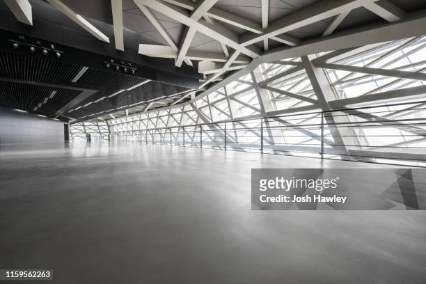 futuristic empty room, 3d rendering - hanger stock-fotos und bilder