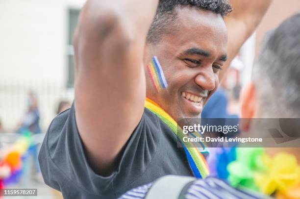 gay couple marching in pride celebrations - festival float stock pictures, royalty-free photos & images