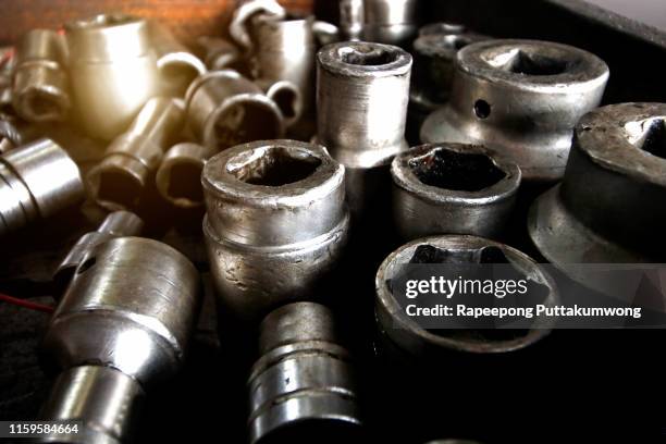 socket wrench with nuts and bolt in the old tool box - socket set stock pictures, royalty-free photos & images