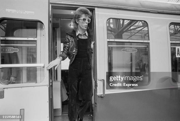 David Bowie at Victoria Station, London, 9th July 1973. He is on his way to France to record his covers album, 'Pinups' at the Château d'Hérouville.