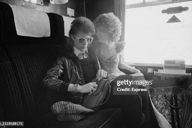 David Bowie and his wife Angie at Victoria Station, London, 9th July 1973. David is on his way to France to record his covers album, 'Pinups' at the...