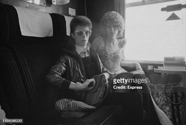David Bowie and his wife Angie at Victoria Station, London, 9th July 1973. David is on his way to France to record his covers album, 'Pinups' at the...