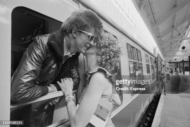 David Bowie and his wife Angie at Victoria Station, London, 9th July 1973. David is on his way to France to record his covers album, 'Pinups' at the...