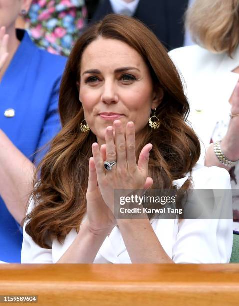 Catherine, Duchess of Cambridge claps as she attends day 2 of the Wimbledon Tennis Championships at the All England Lawn Tennis and Croquet Club on...