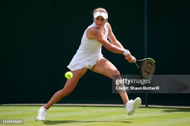 Kateryna Kozlova of Ukraine runs to play a backhand in her Ladies' Singles first round match against Lauren Davis of The United States during Day two...