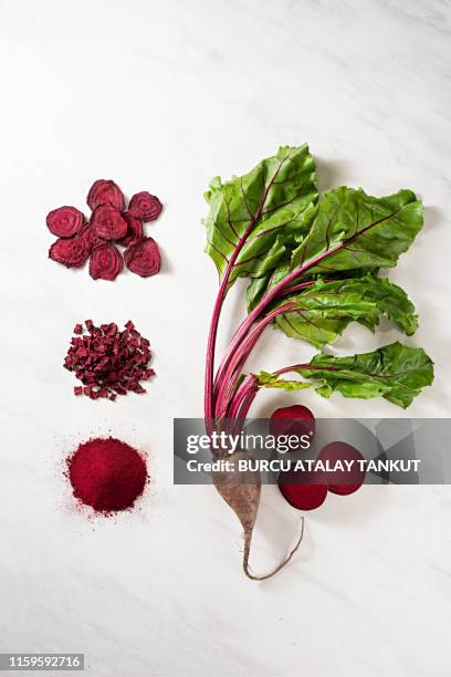 red beet powder and beet chips - beet stock pictures, royalty-free photos & images