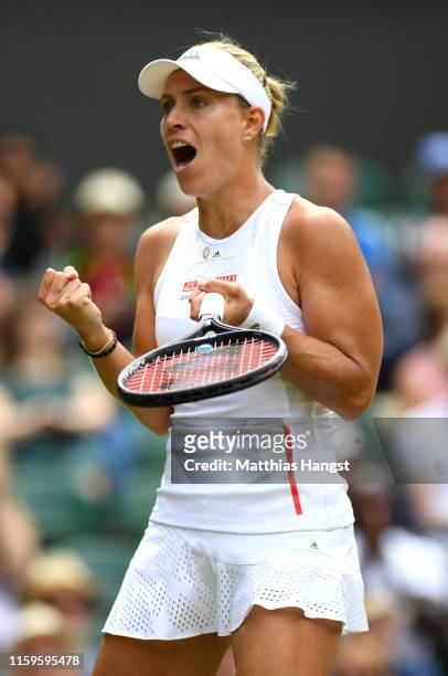 Angelique Kerber of Germany celebrates winning the first set in her Ladies' Singles first round match against Tatjana Maria of Germany during Day two...