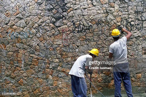 workers removing graffiti - cleaning graffiti stock pictures, royalty-free photos & images