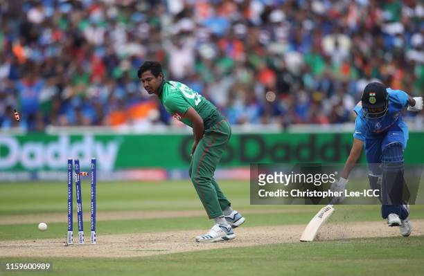 Mustafizur Rahman of Bangladesh runs out Bhuvneshwar Kumar of India during the Group Stage match of the ICC Cricket World Cup 2019 between Bangladesh...