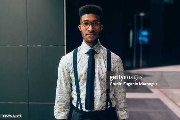 businessman standing in front of office building - suspenders stock pictures, royalty-free photos & images